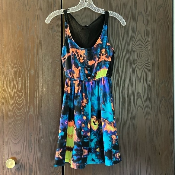 Hurley Dresses & Skirts - Hurley black with vibrant color pattern. See through back panel. Size XS.